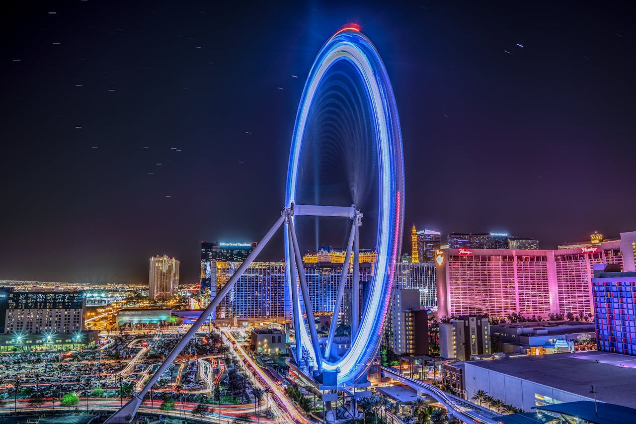 Stunning view of the Las Vegas skyline featuring an illuminated Ferris wheel at night.